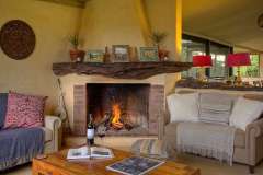 asilia-ol-pejeta-bush-lounge-area-with-fireplace
